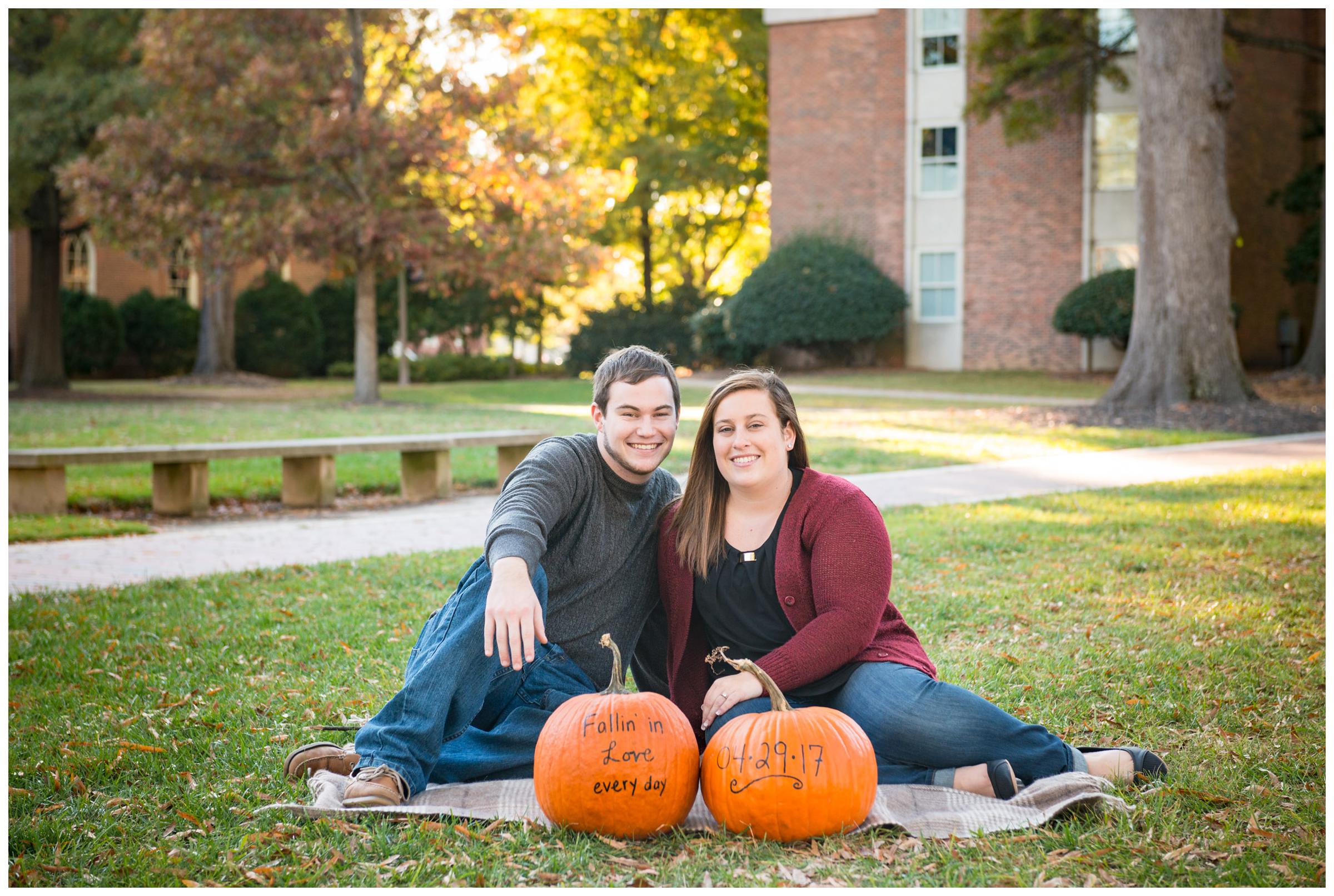 Fall engagement photos with pumpkins.