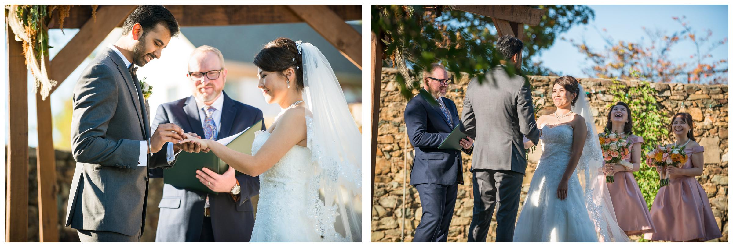 Bride laughing and couple exchanging rings during rustic wedding ceremony in Virginia.