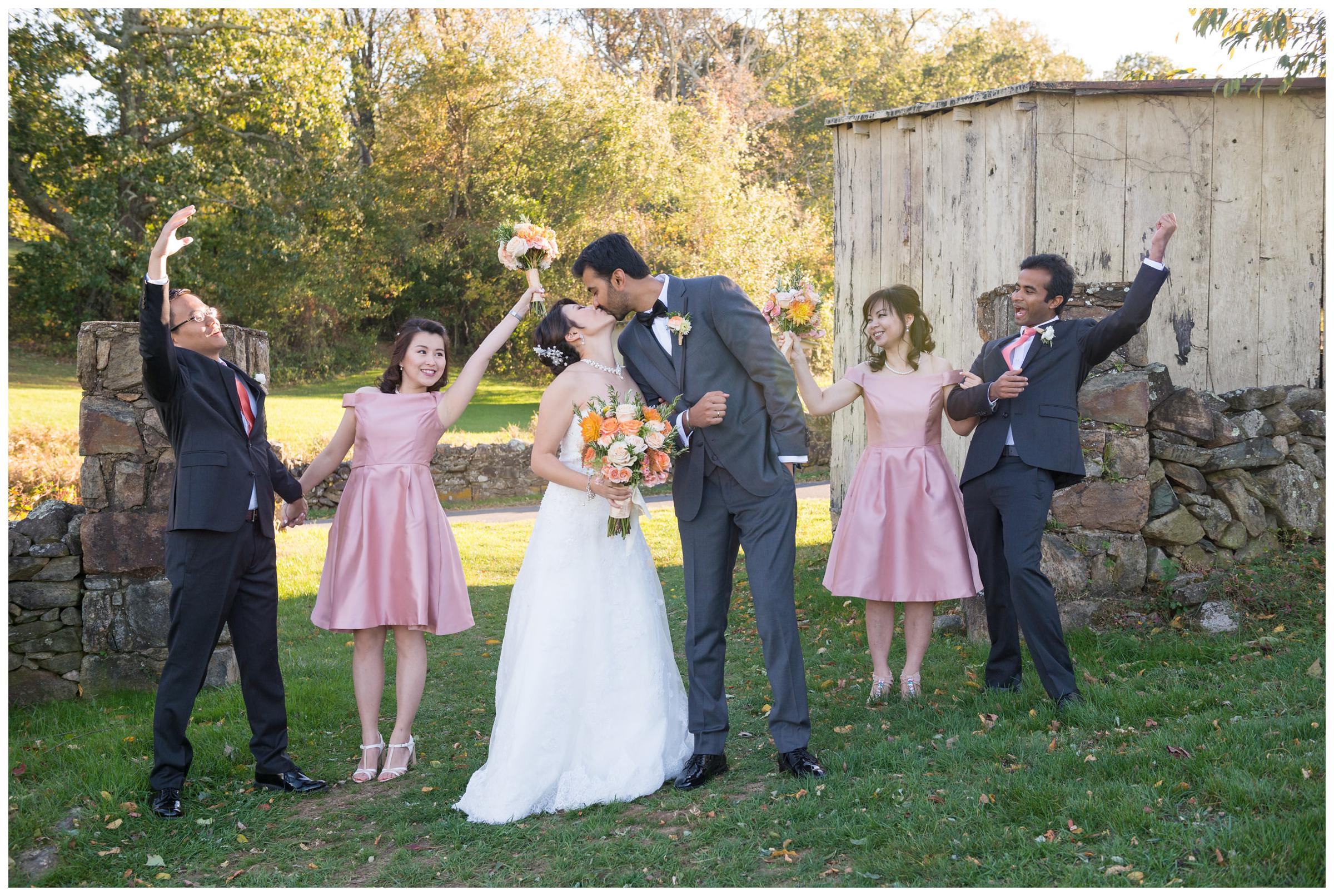 Portrait of bridal party near stone ruins at Stoneleigh Golf Club in Virginia.