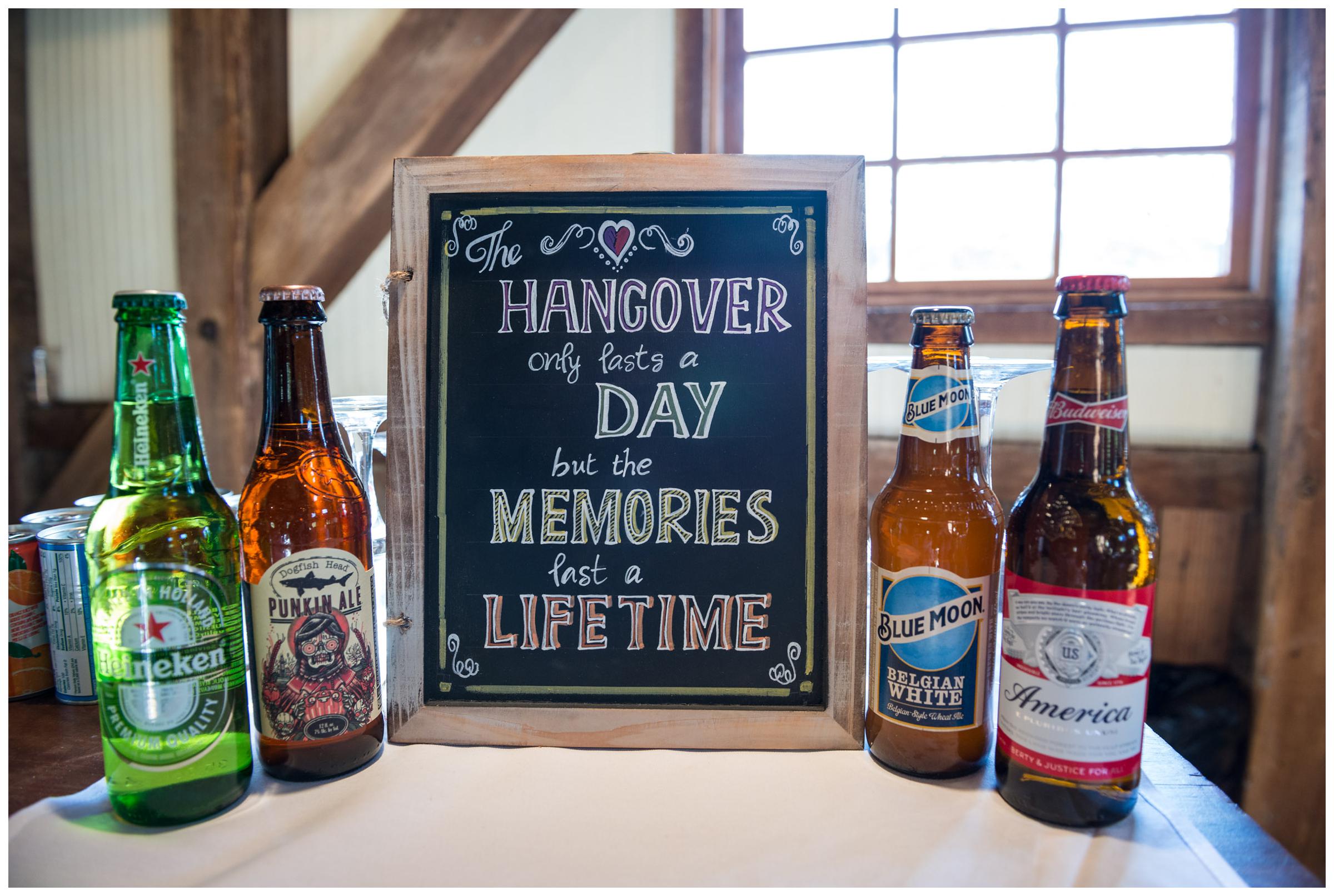 Chalkboard bar sign at rustic barn wedding.