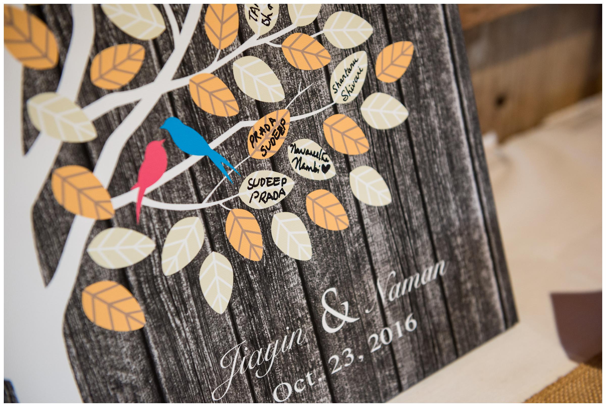 Canvas tree signature guestbook at rustic wedding.