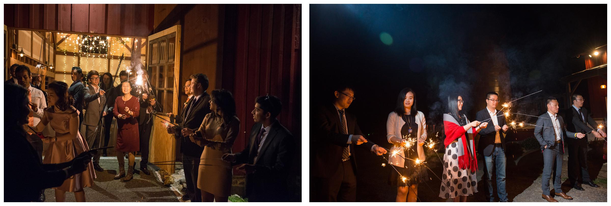 Wedding guests light sparklers in preparation for the bride and groom's grand exit.