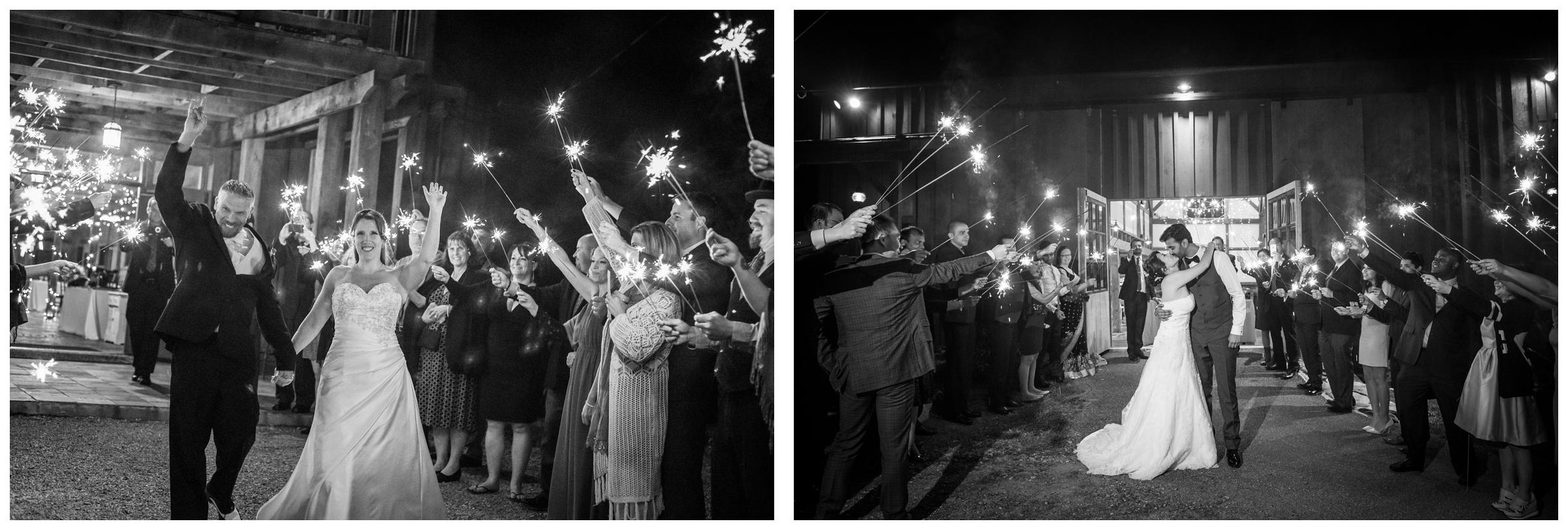 wedding guests cheering during bride and groom's sparkler exit