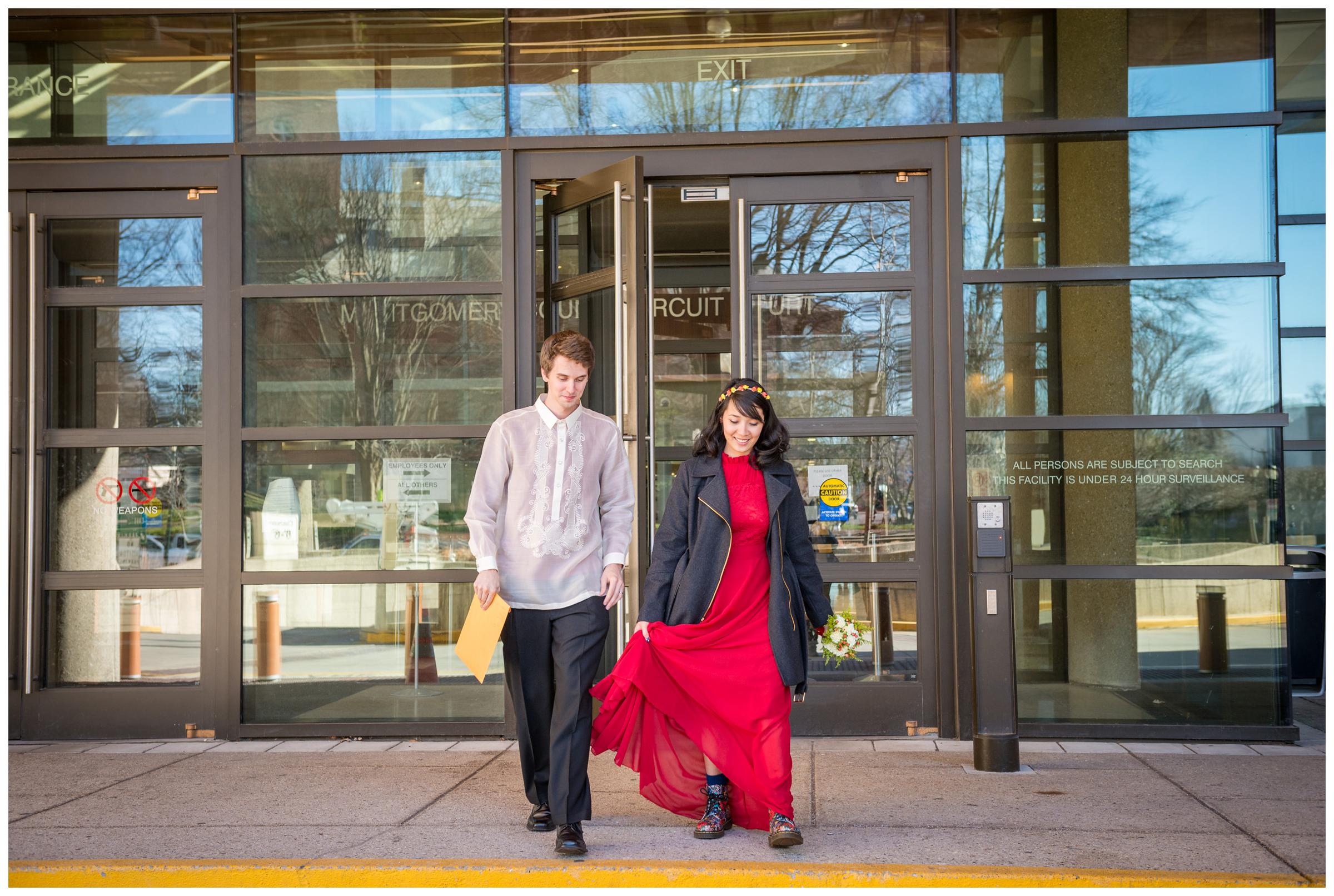 bride and groom exiting Montgomery County Courthouse after eloping. 