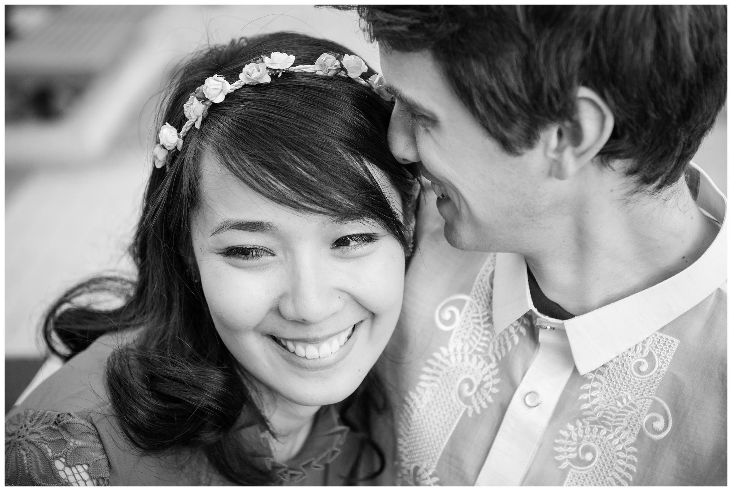 groom nuzzling bride on wedding day