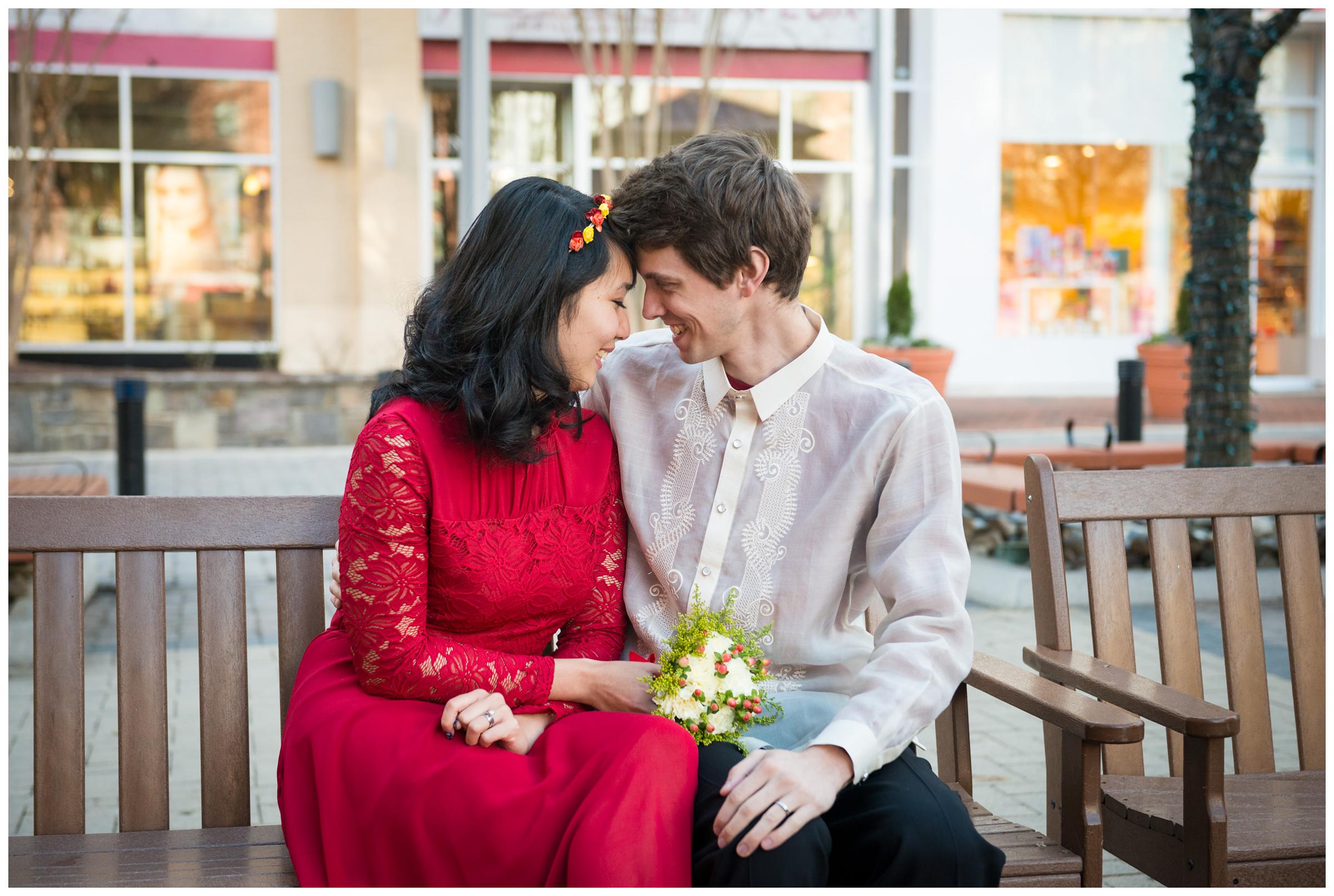 bride and groom cuddling in Rockville Town Square in Maryland.