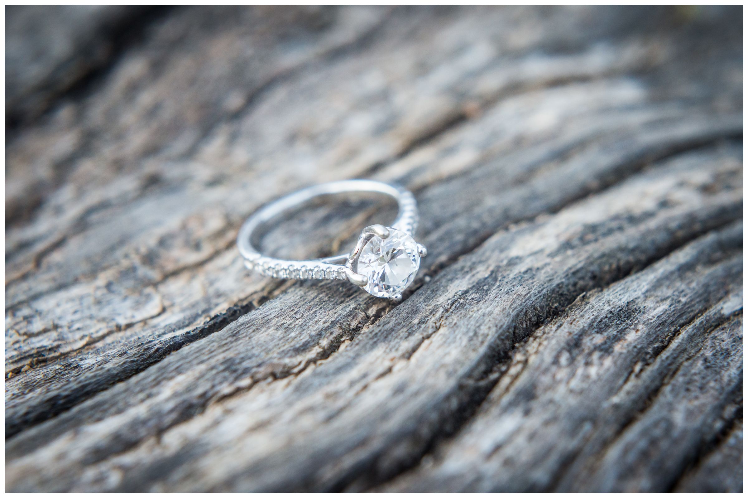 engagement ring on rough wood