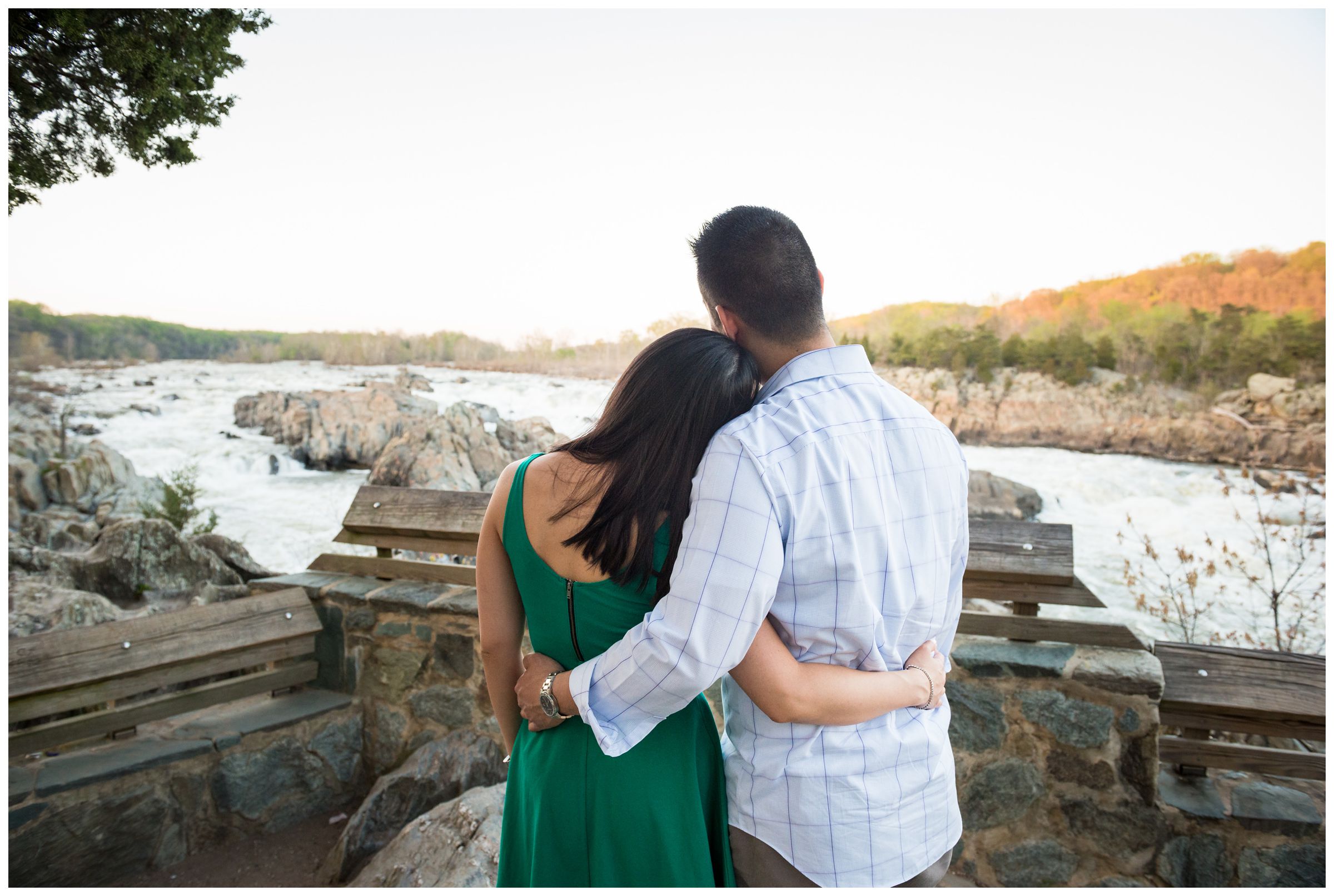 engaged couple along river overlook at Great Falls Park in Northern Virginia