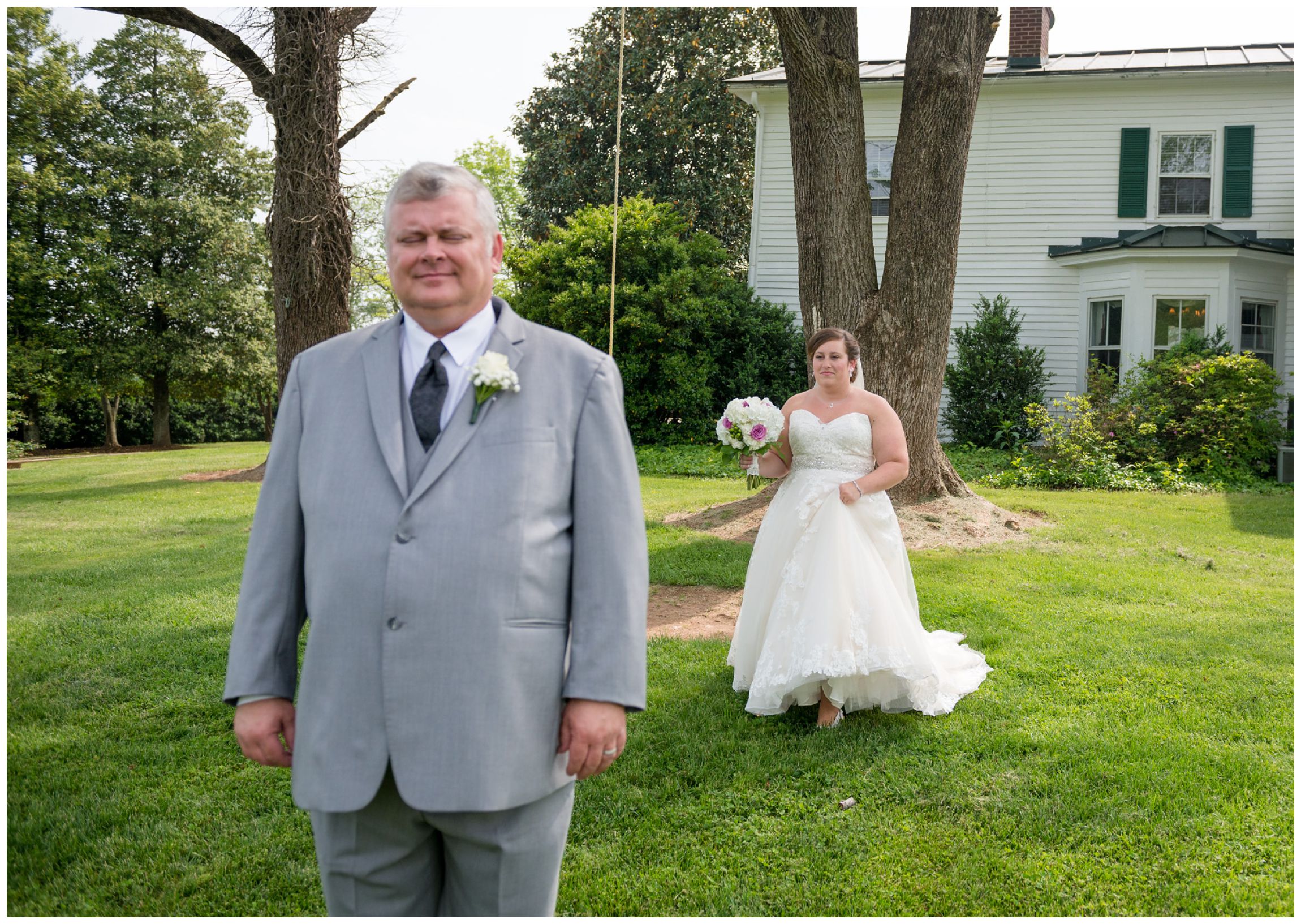 bride and dad share a first look moment before wedding ceremony at Wolftrap Farm