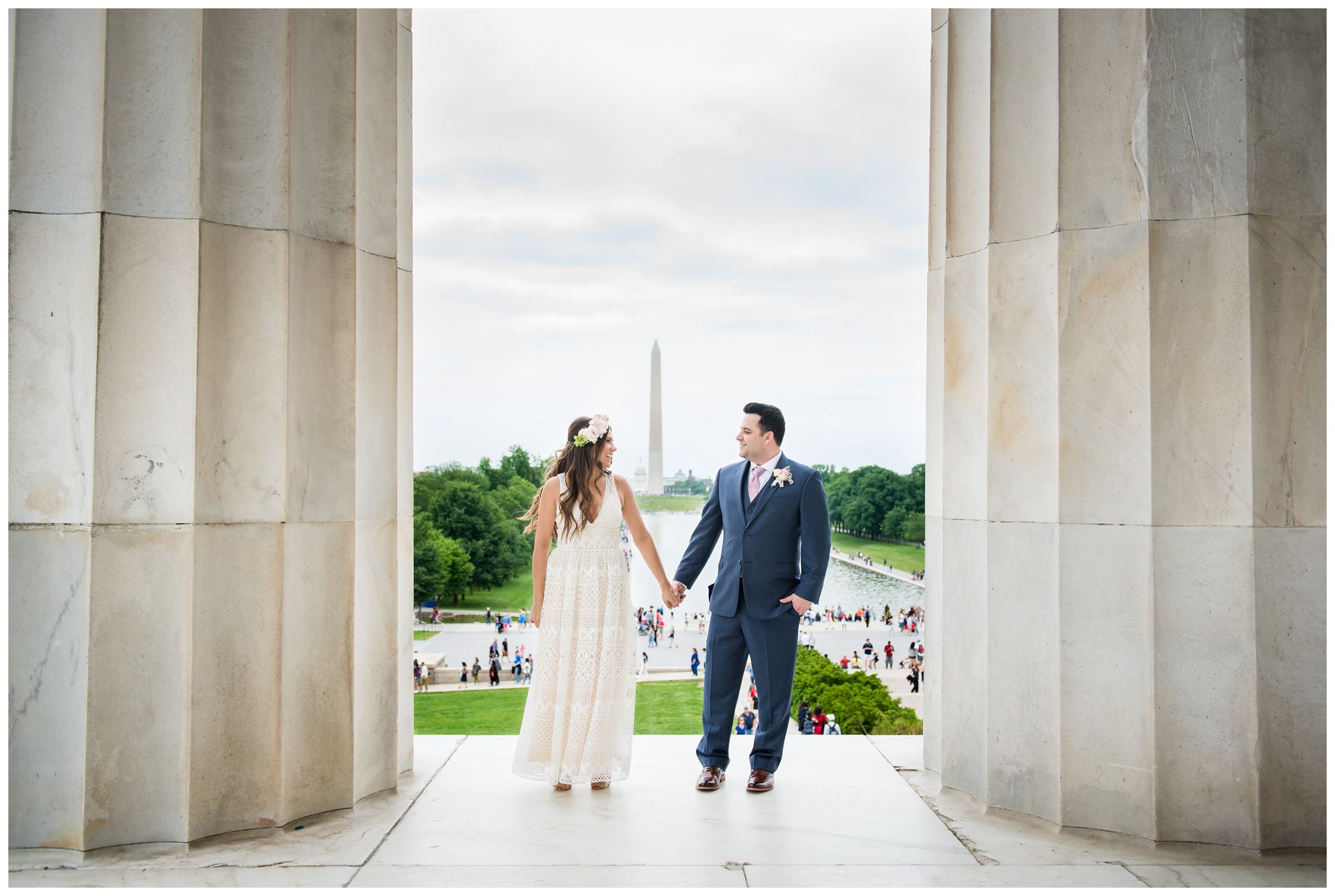 bride and groom portraits in front of reflecting pool and Washington Monument during DC monument wedding day on National Mall