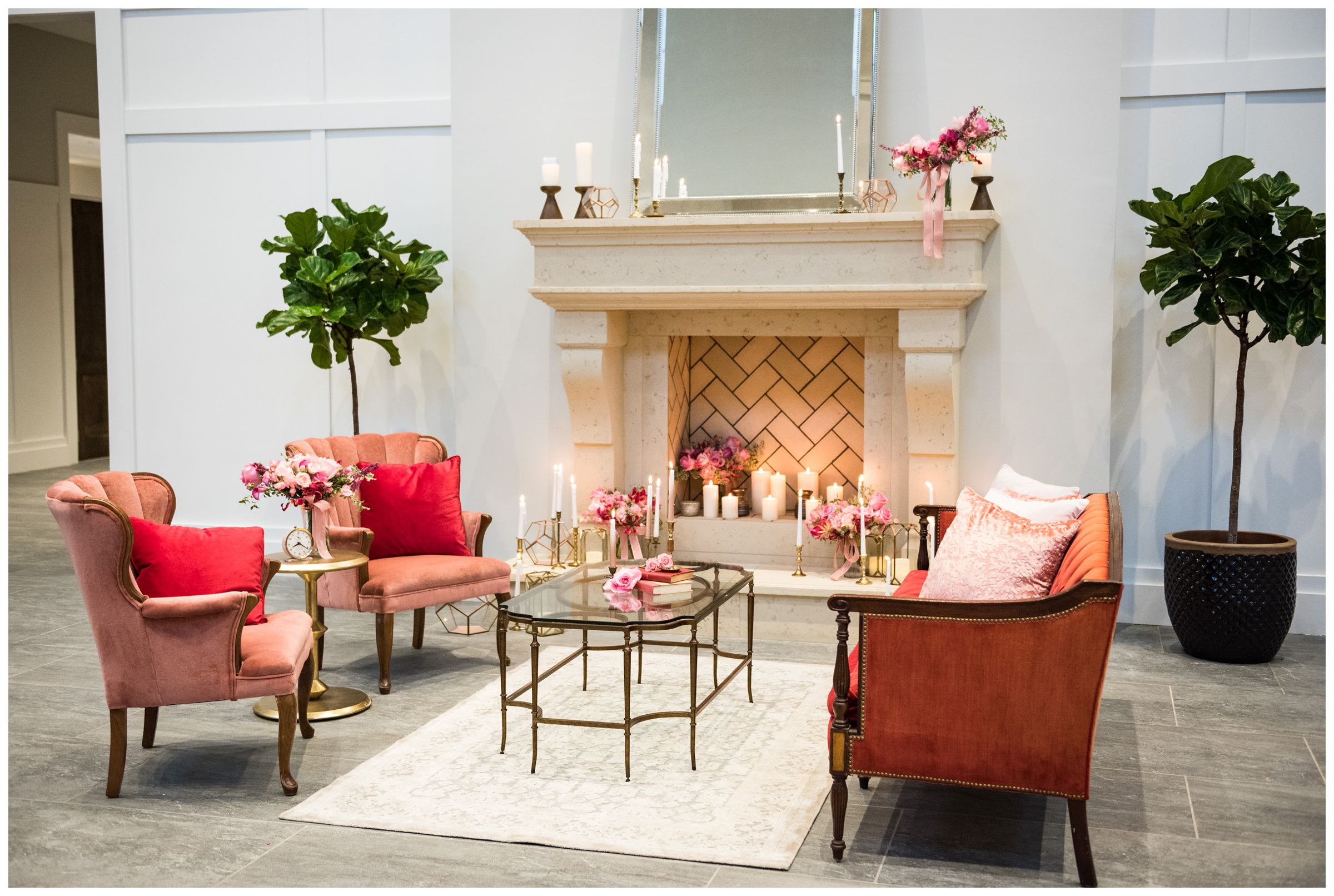 lounge area with pink accents and fireplace at the Estate at New Albany wedding venue near Columbus, Ohio