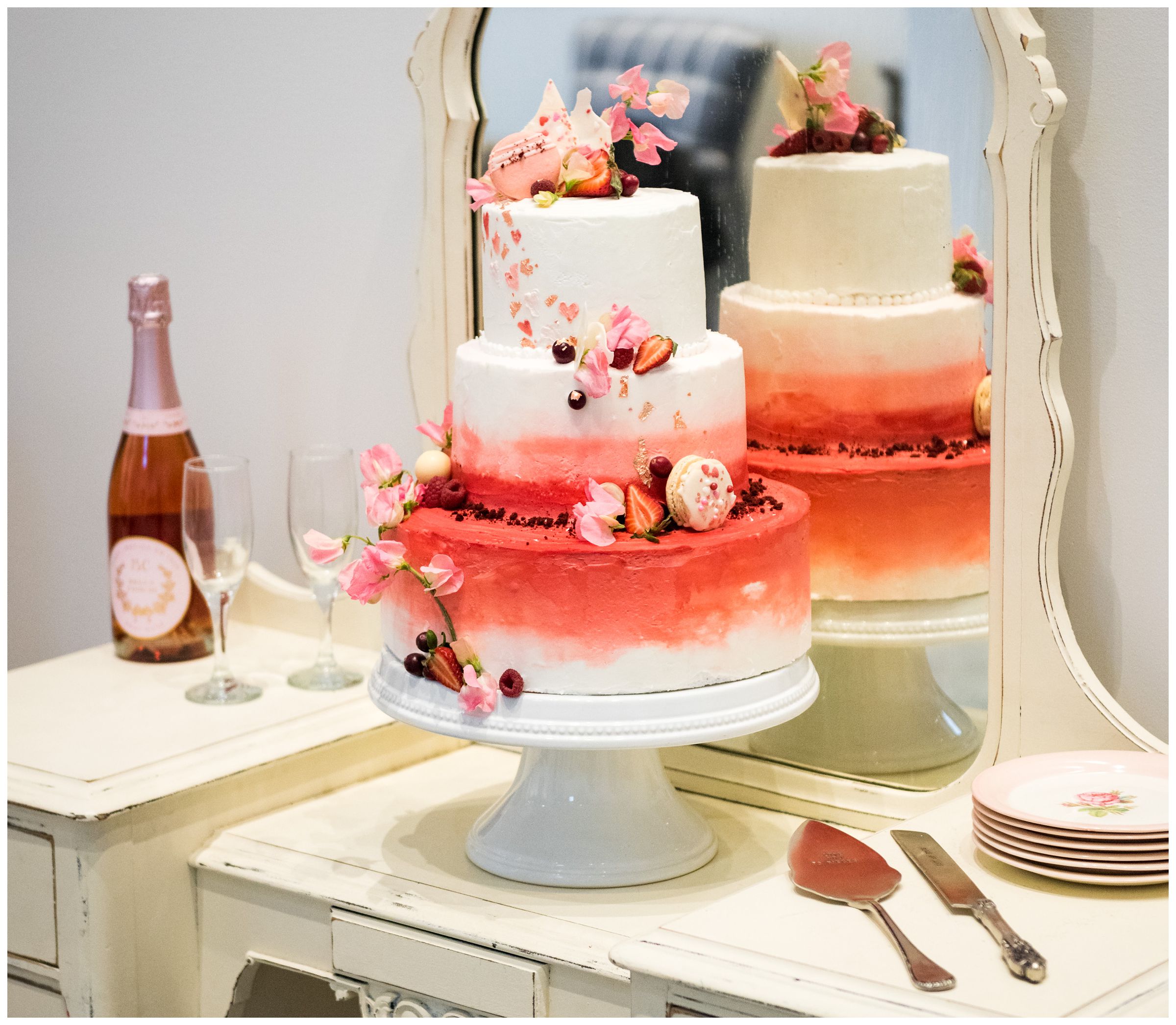 wedding cake with pink macaroons and fruit by Ovenbird Baking in Columbus, Ohio