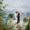 wedding photo by lake with leaves and greenery