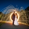 bride and groom with ring of fire raining fire nighttime long exposure wedding photography