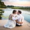 Lancaster Ohio wedding photography of bride and groom sitting by pond during farm wedding