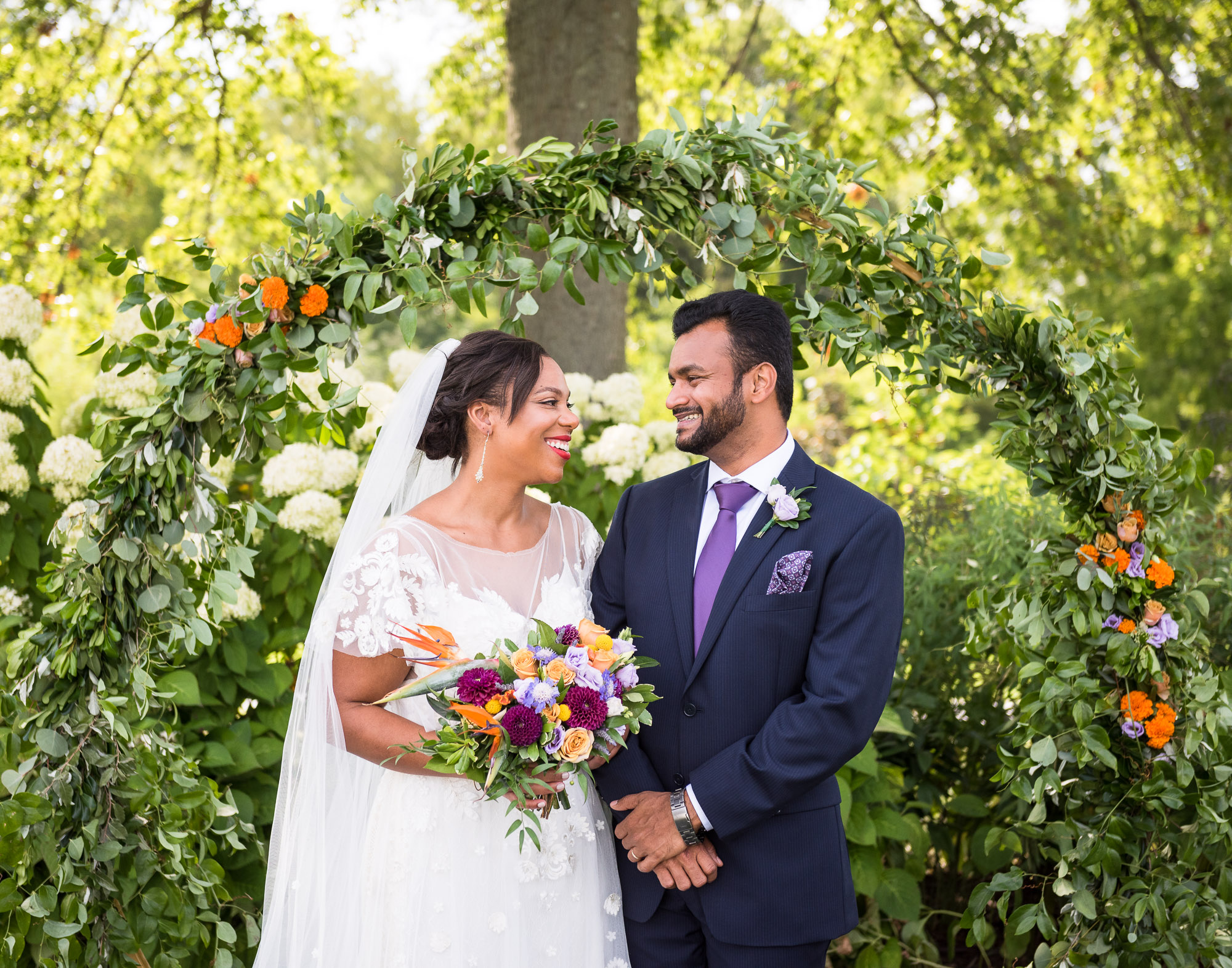 Indian groom and African American bride at Jorgensen Farms wedding in Ohio