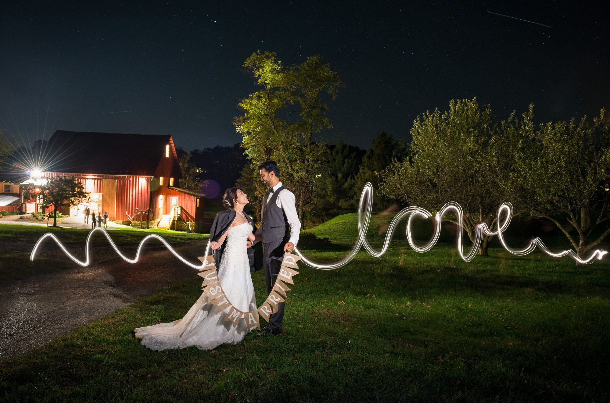 nighttime light painting wedding photography at barn wedding