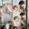 couple getting ready for wedding reflected in mirror