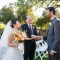 dad giving away Asian bride during wedding ceremony in Columbus Ohio