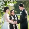 bride and groom laughing during wedding ceremony on golf course in Columbus Ohio