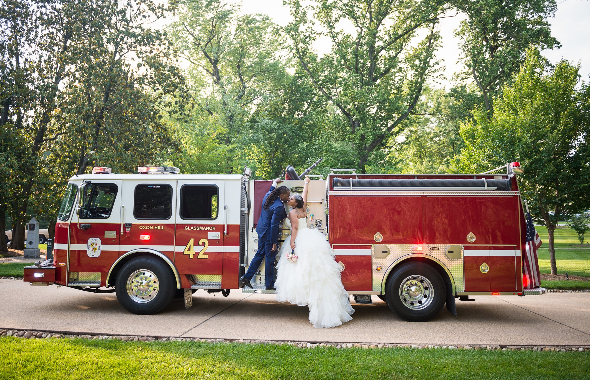 bride and groom wedding photo with firetruck