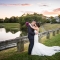 Asian wedding couple at sunset near lake