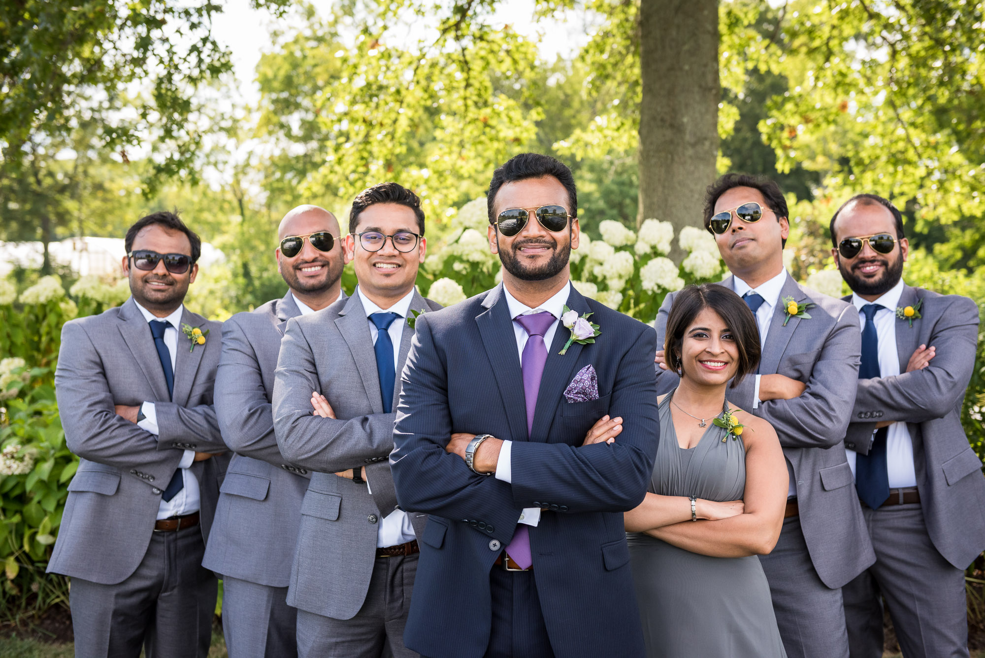 Indian groom and coed mixed gender wedding party wearing Ray Ban sunglasses at Jorgensen Farms