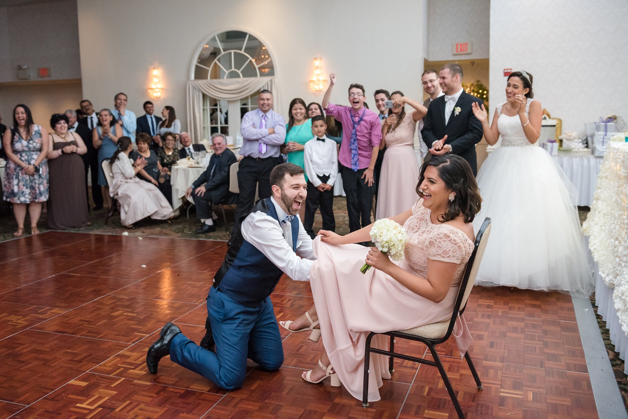 garter toss reaction at wedding reception