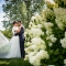 bride and groom with hydrangeas by Jorgensen Farms wedding photographer in Columbus Ohio