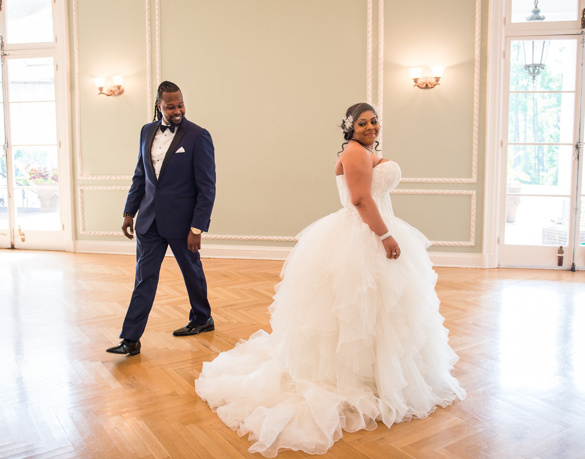 African American bride and groom first look reaction