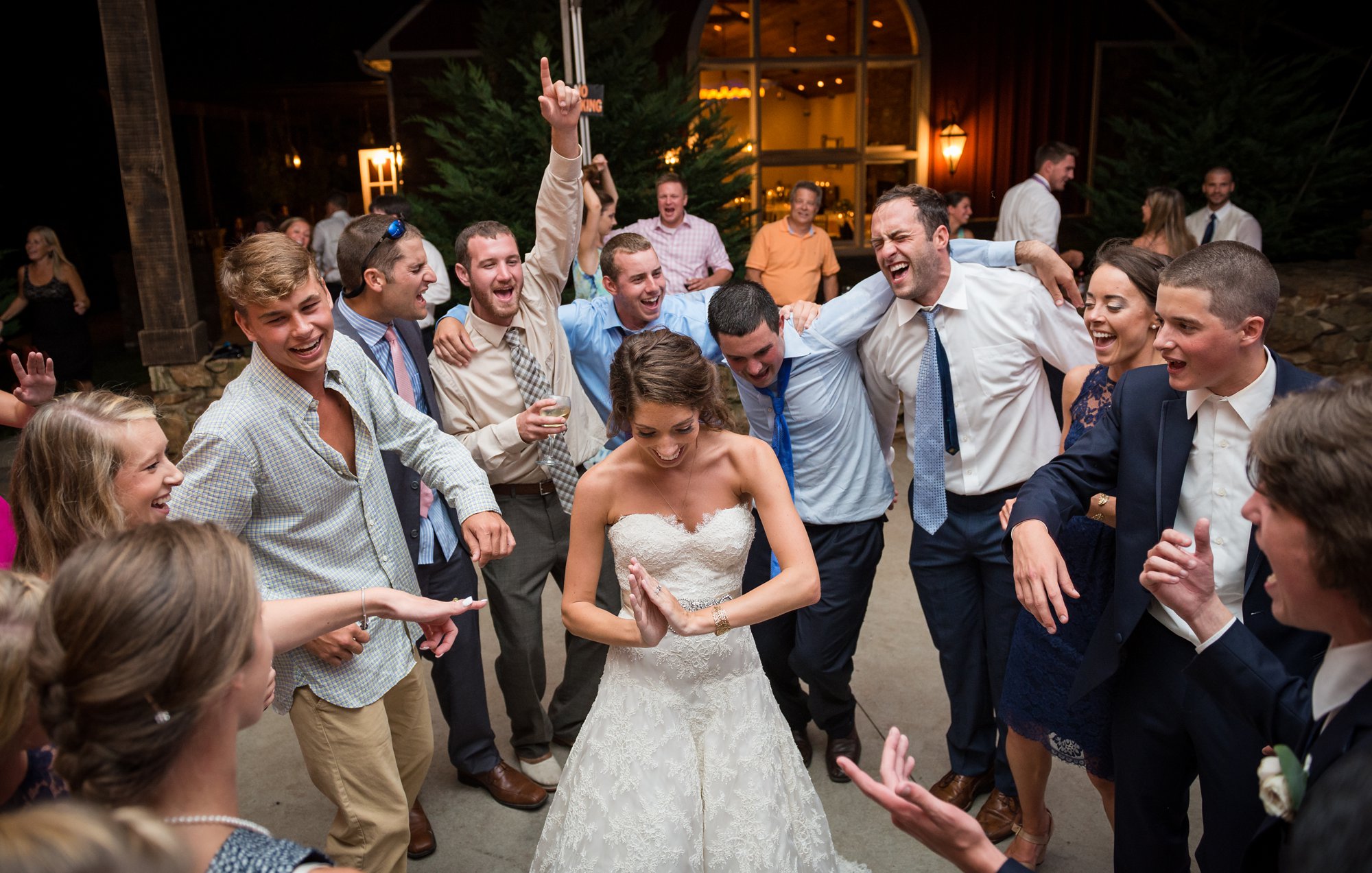 bride dancing with friends at wedding reception