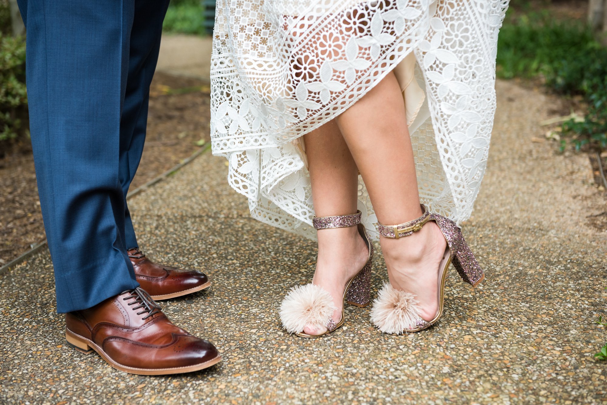 bride wearing pink glittery pumps with pom poms