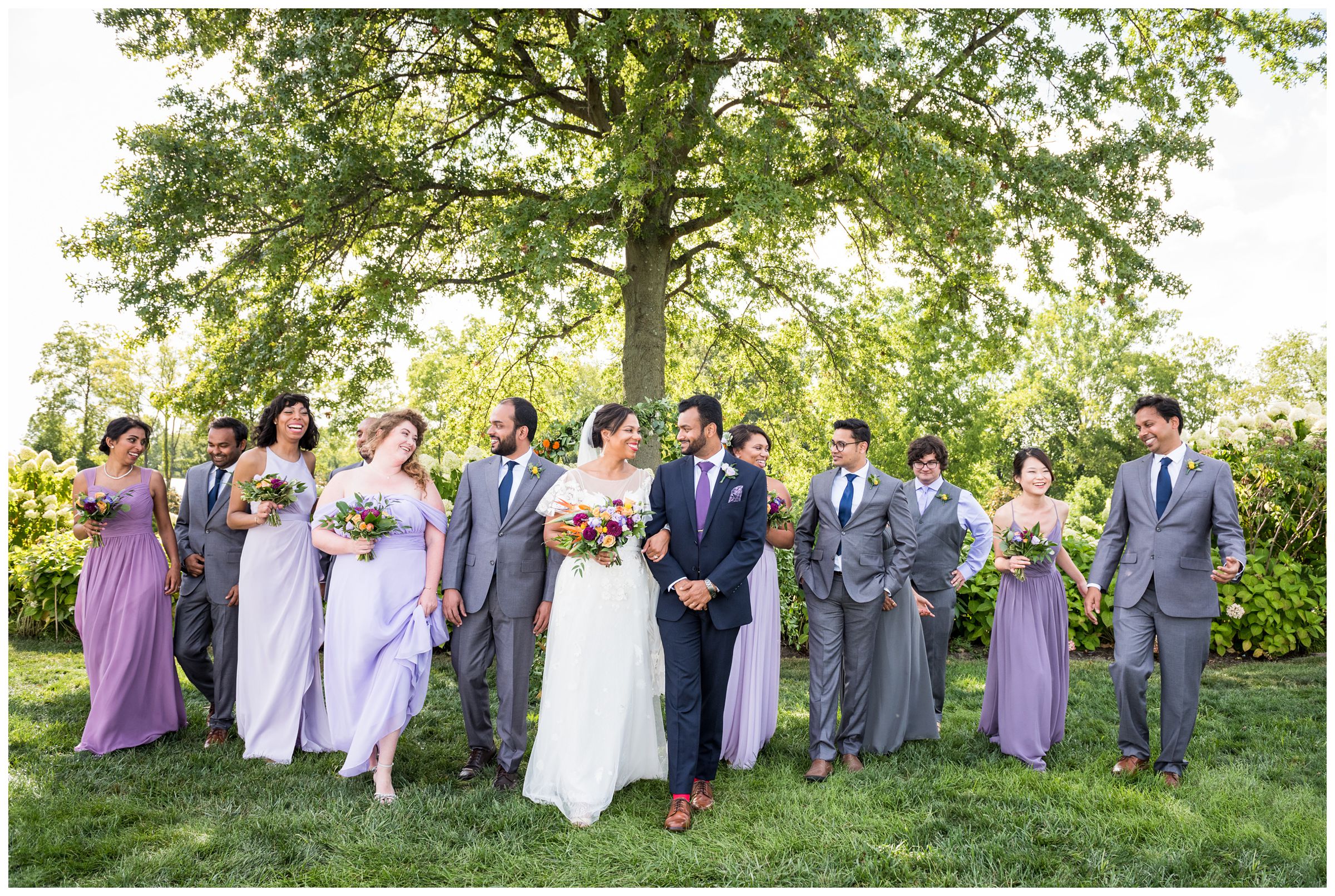 light purple, blue and gold wedding party with diverse ethnicities