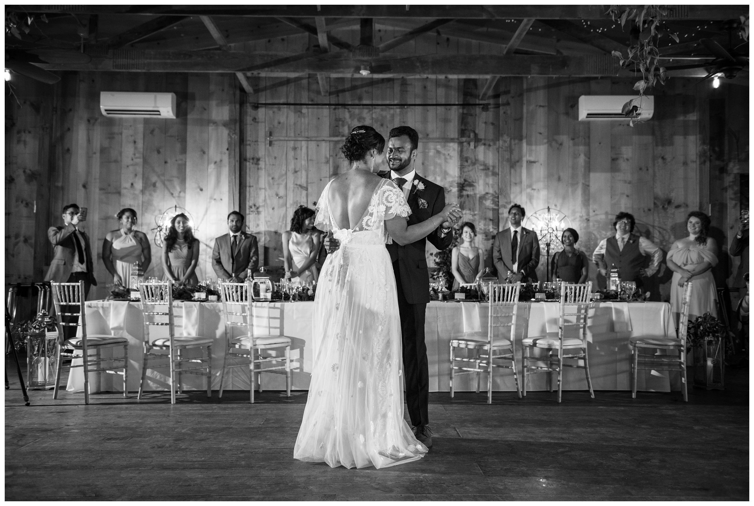 bride and groom first dance during rustic wedding reception at Jorgensen Farms in Columbus Ohio