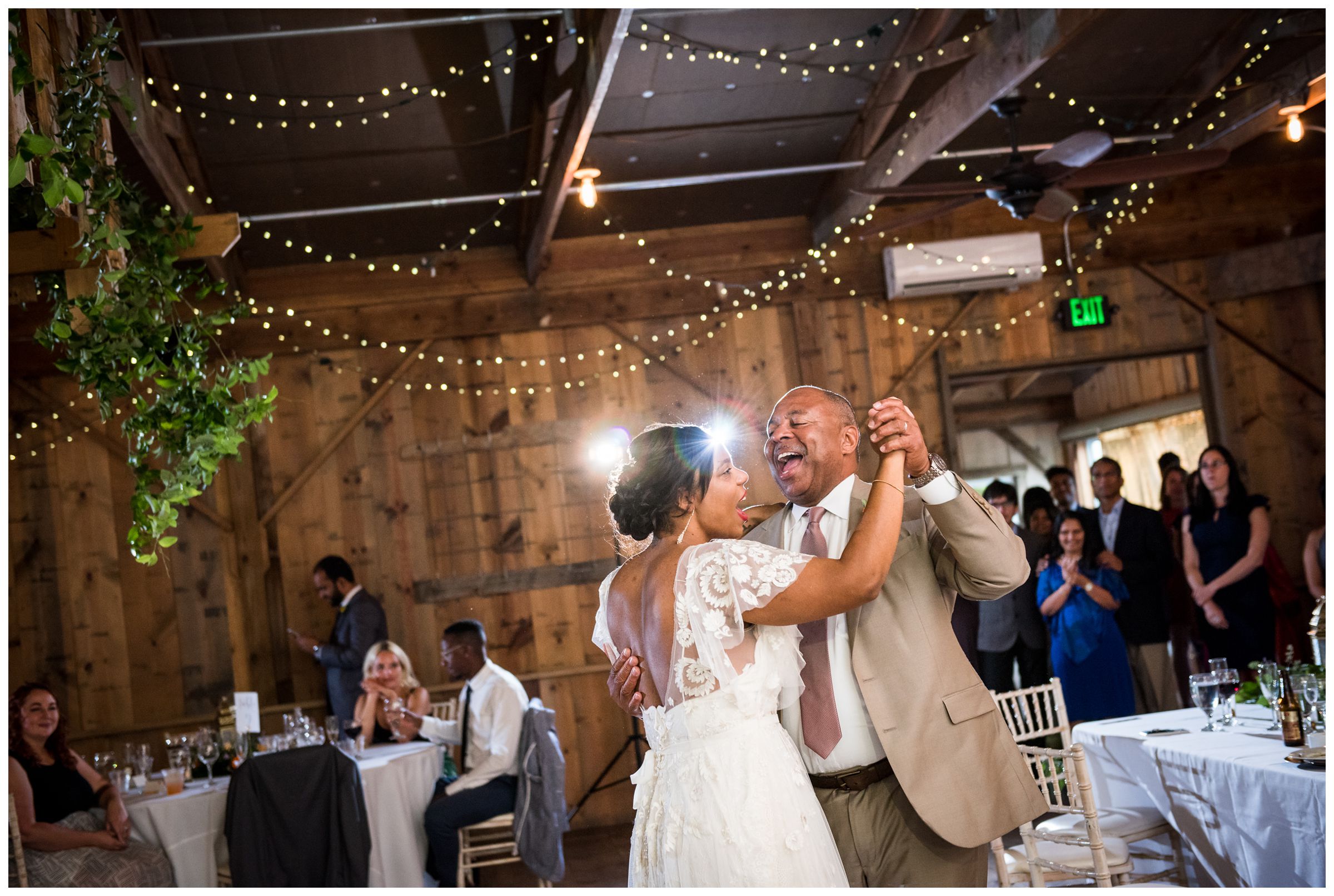 father daughter dance during rustic wedding reception at historic barn