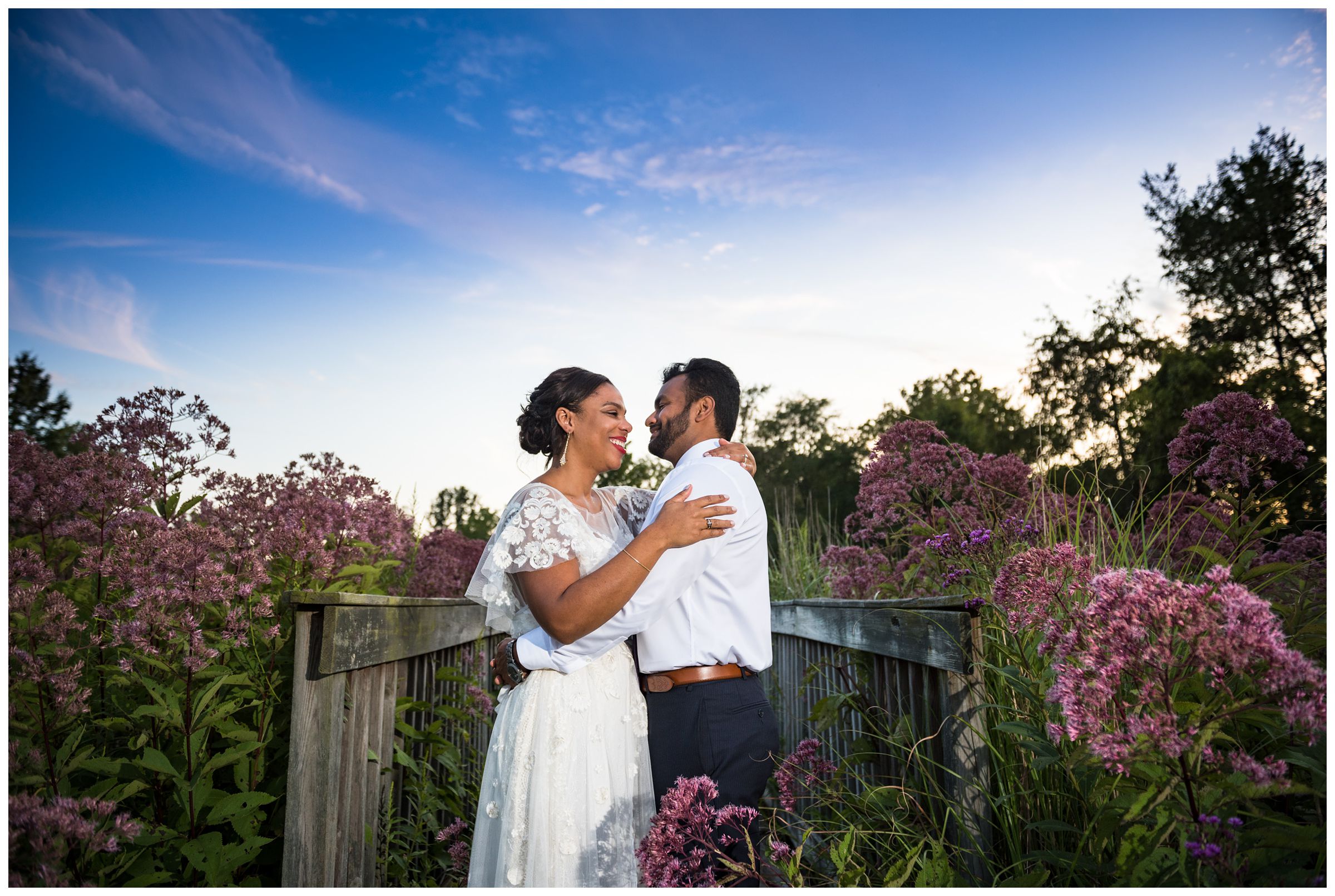 Columbus sunset wedding photos on bridge in flower field at Jorgensen Farms