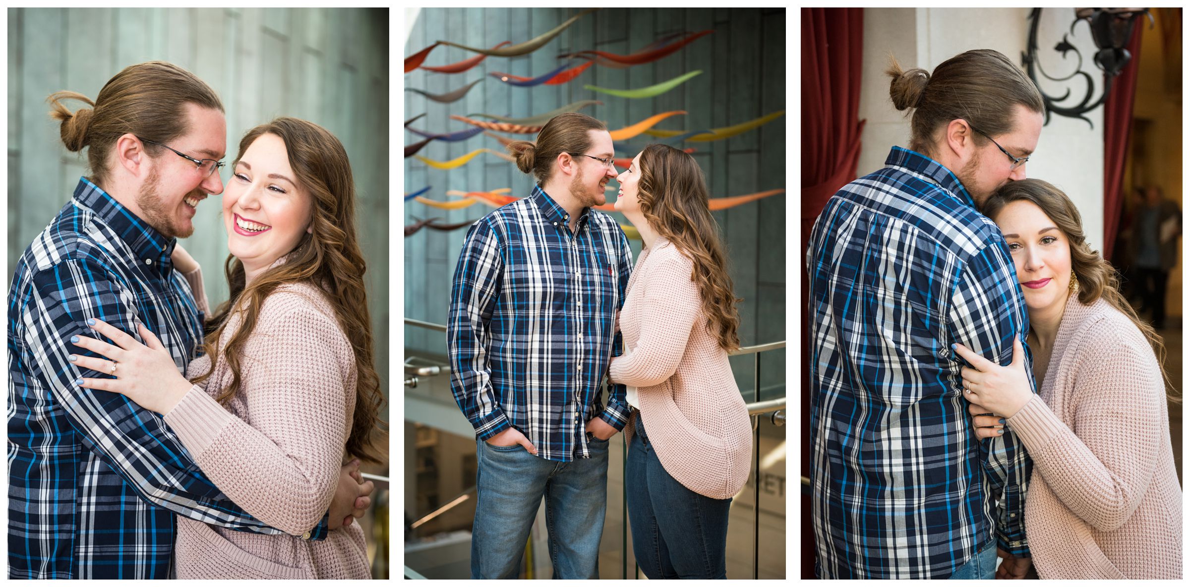 Winter indoor engagement session in the atrium of the Columbus Museum of Art surrounded by colorful hanging glass artwork.