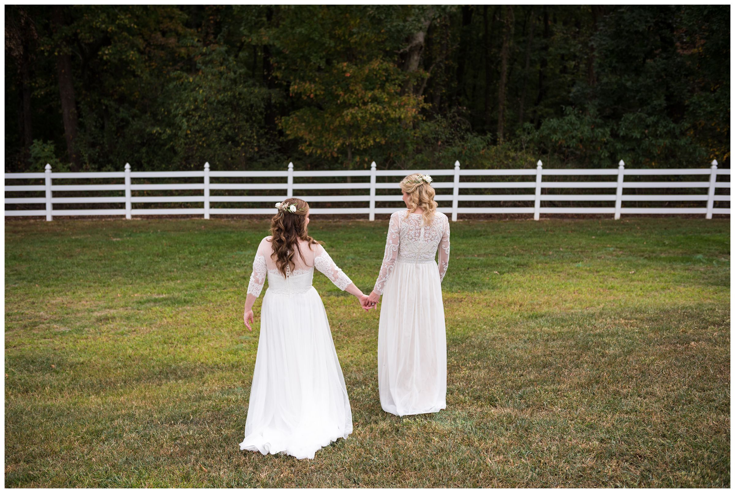 Two brides walking on family farm in central Ohio