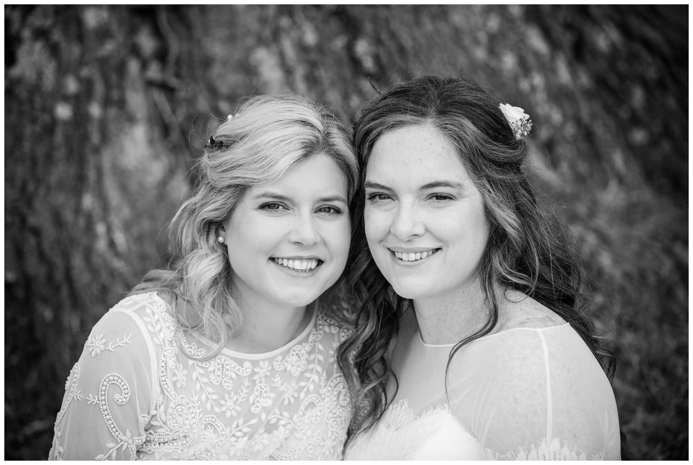 Portrait of two brides on wedding day.