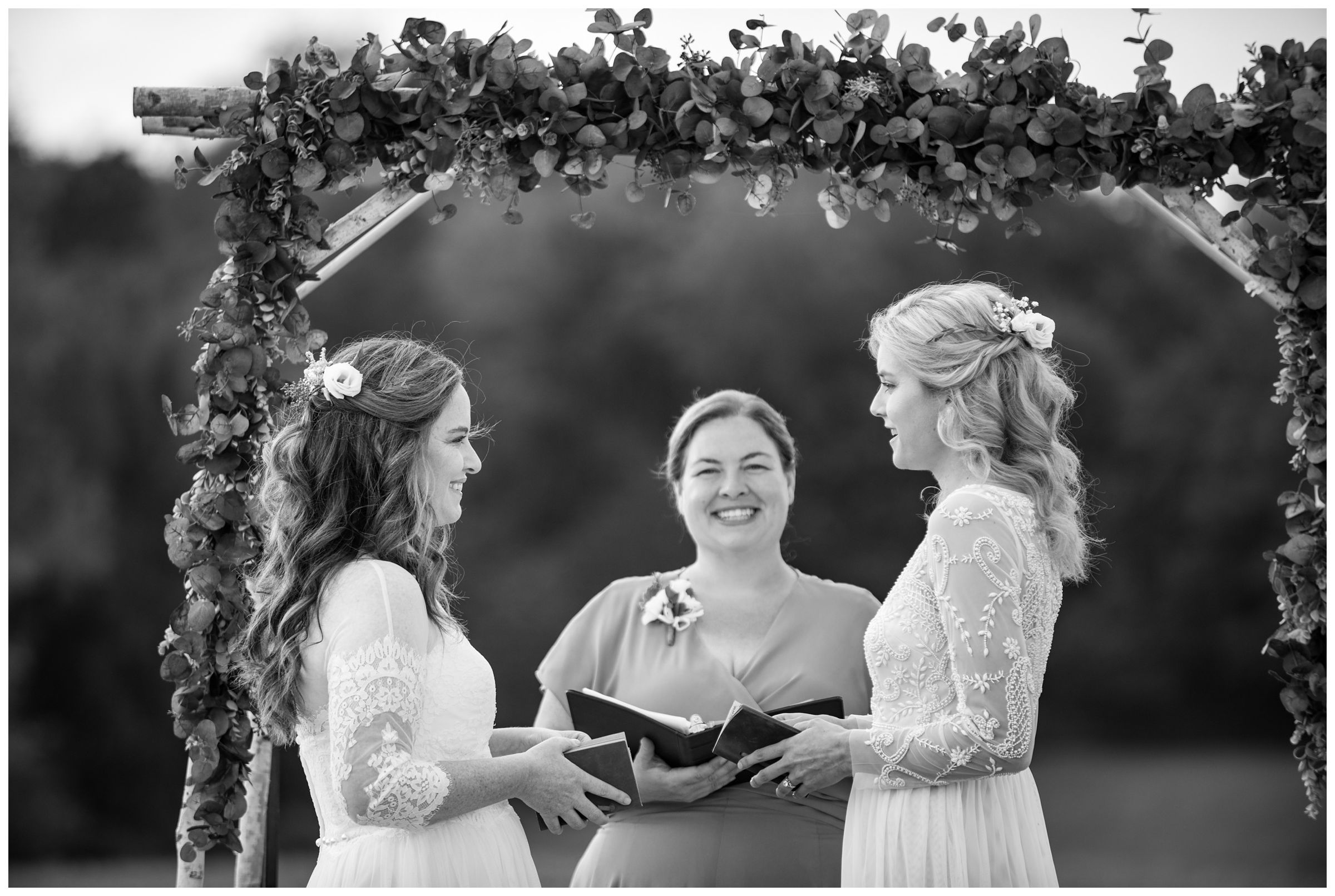 Two brides exchange vows during same-sex wedding.
